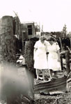 Nurses at the scene of a fire which destroyed their quarters in 1945