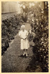 Nurse Dorothy Beasley in the garden at Tannachy Hospital, Rockhampton ca. 1940