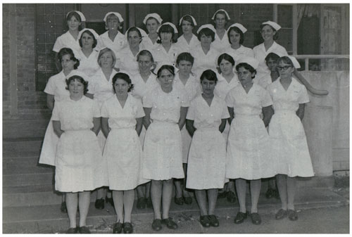 A group of nurses on the steps of the Rockhampton Hospital ca. 1968