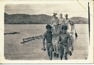 RAAF Sister Edna Weber assisted by New Guinean men during World War 2