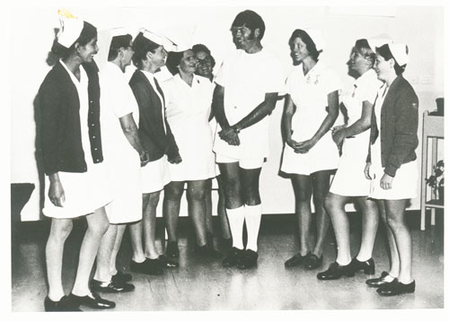 Brian Sedgeman, top Queensland nurse in 1974, being congratulated by colleagues.